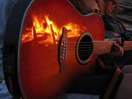The least obnoxious picture I could find for “campfire guitar.”